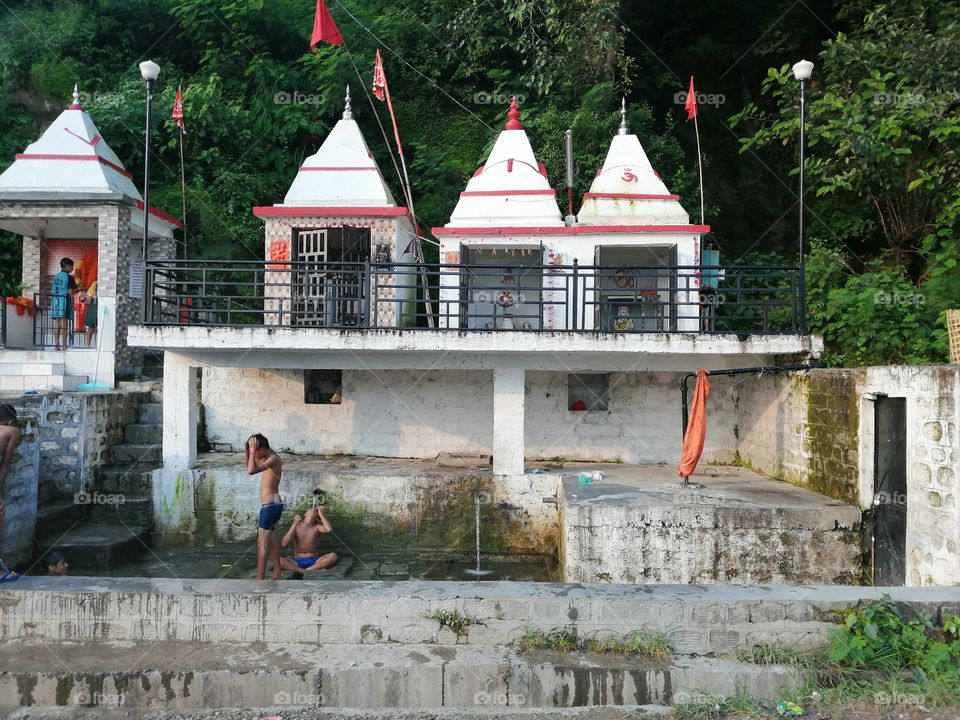 CHILDREN ENJOY THEIR SUMMER SESSIONS BY TAKING COOL BATH WITH NATURAL RESOURCE OF WATER. BEAUTIFUL SCENERY OF FOUR TEMPLES WITH WATER RESOURCE.