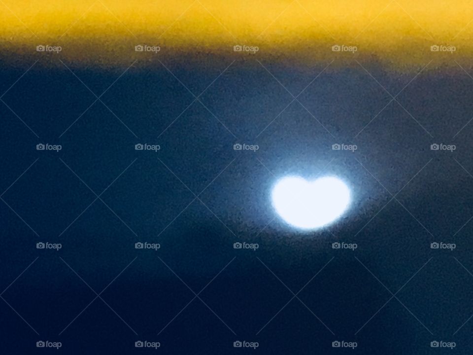 A rare shot from 2018 of a heart shaped moon in the misty night skies over Long Island City, Queens, NY. This is not the result of some special effect but the way the moon appeared that night maybe due to athmospheric lensing. Hypnotic Productions