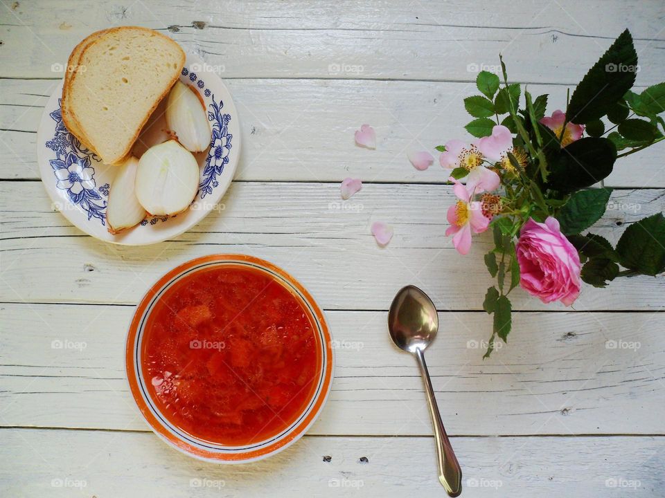 Ukrainian soup and homemade bread on the table