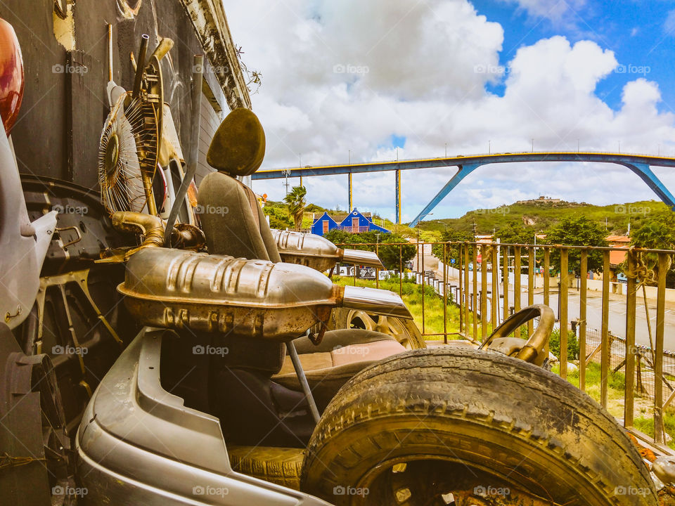 local art, interior car sculpture with the Juliana bridge in the background..