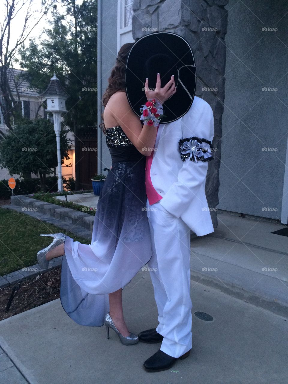 Cowboy kisses before a magical prom night. 