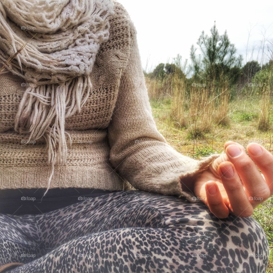 Woman meditating in a field