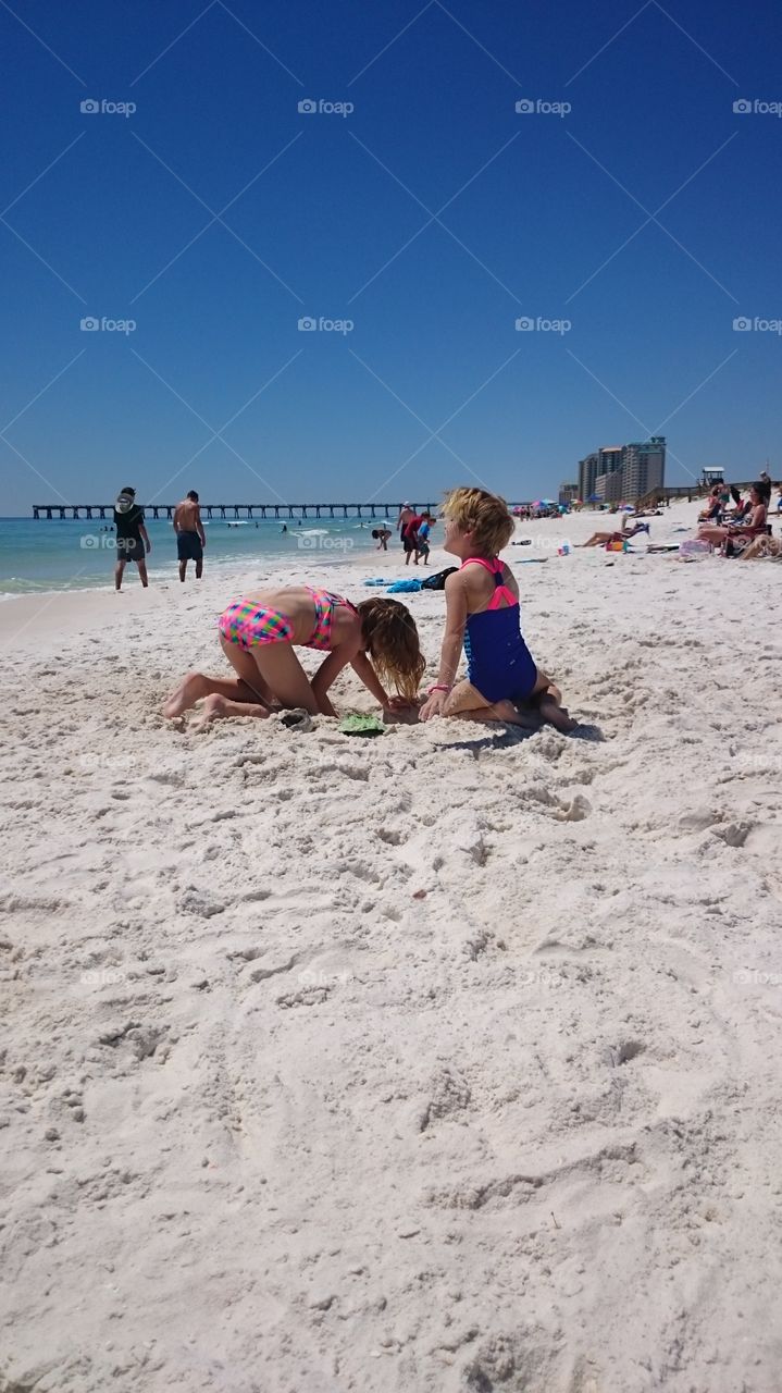 Digging for shells.