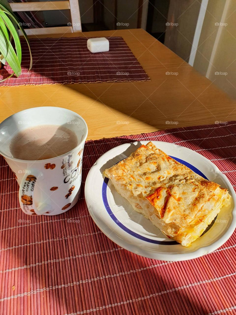 Happy breakfast time with a cup of coffee and cheese sandwich.