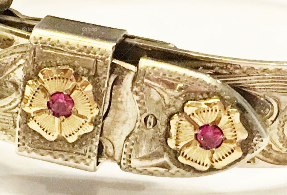 Silver, gold and ruby handmade bracelet designed to look like a belt and buckle. 