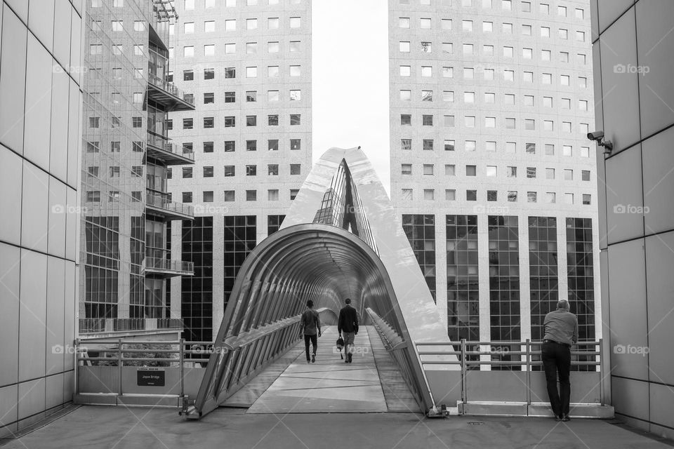 Cityscape with skyscrapers and glass tunnel