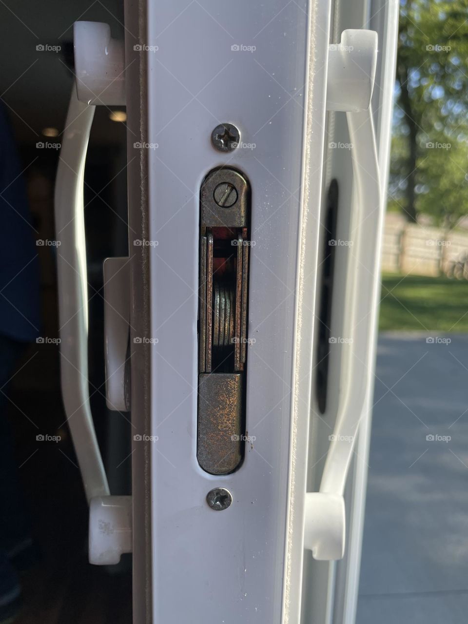 Lock on the patio door, close up of lock on the glass door, sliding door to patio 