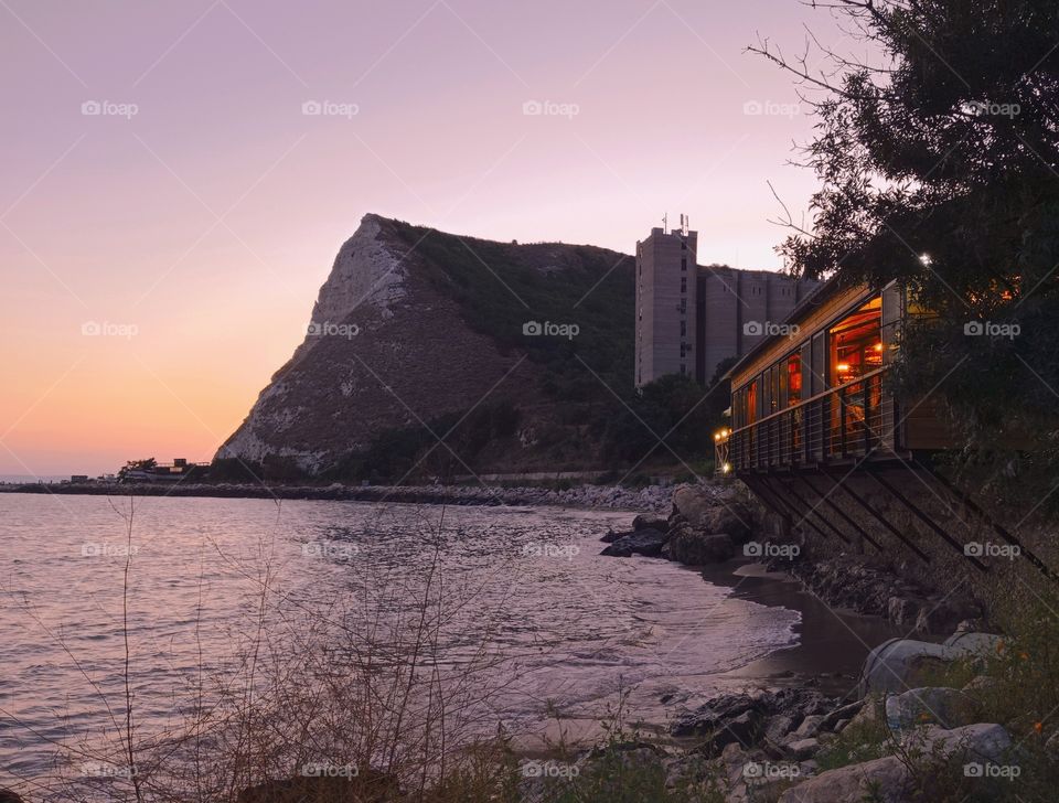 Night lighting at sunset over the sea