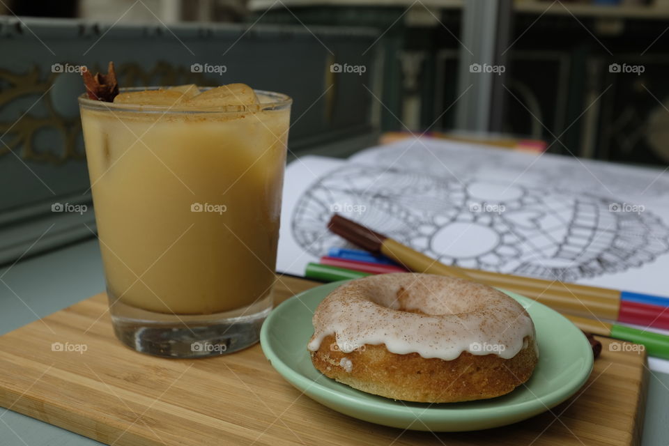 Coffee and a doughnut, with a sugar skull.