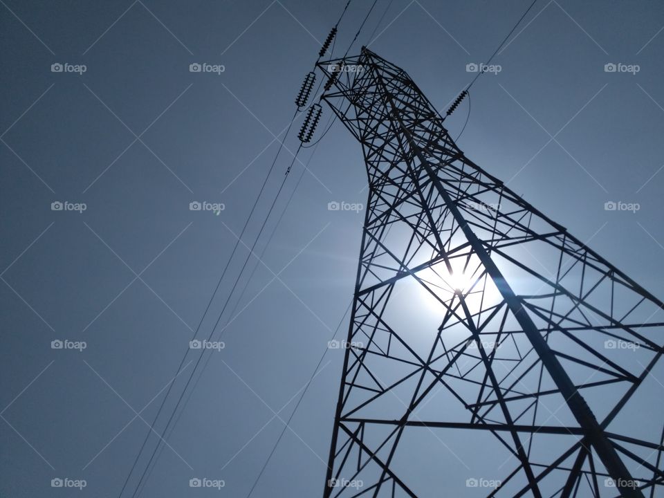 Electrical Transmission Poles / Transmission Lines / Electricity Poles / Power Poles / Sunlight / Solar Energy and Electrical Energy / High Voltage /  Sunny / Randomly clicked picture