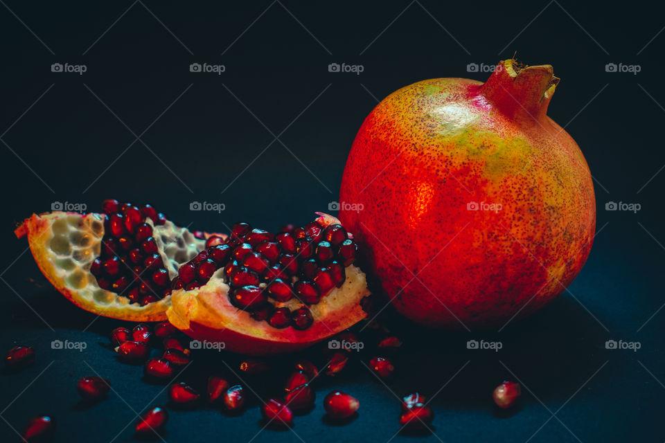 pomegranate fruit on a black background