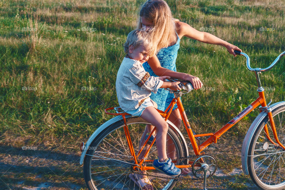 Sibling's love. Girl loves her little brother and kissing him