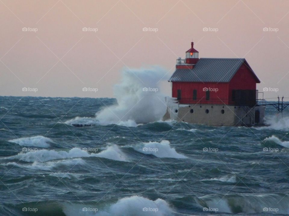 windy, wintry and waves. Grand Haven lighthouse early winters day