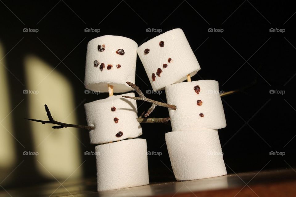 Two friendly marshmallow snowmen 