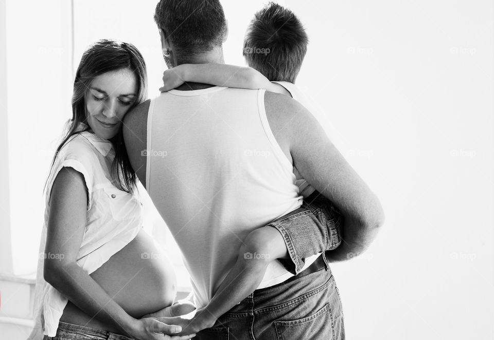 Pregnant mother with father and little boy