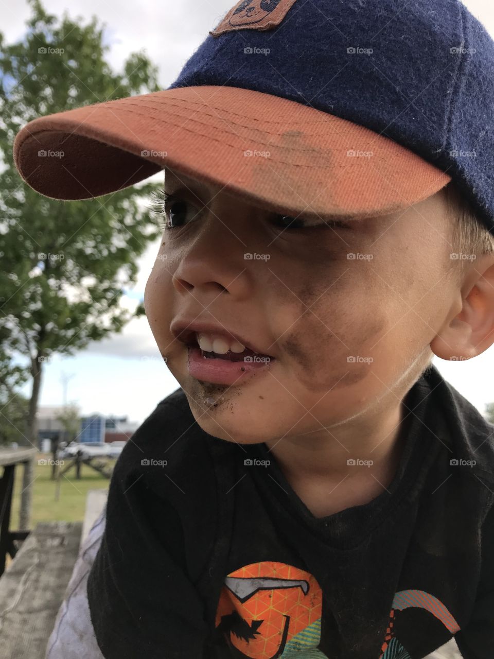 Young boy with dirt on his face