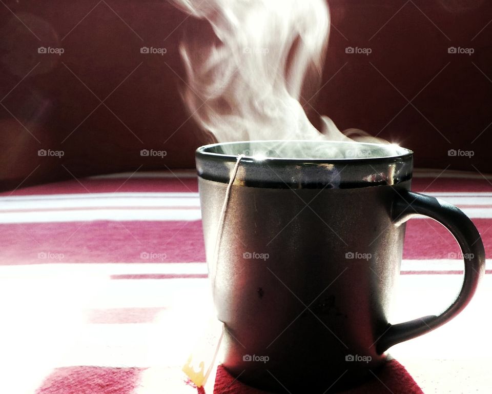 Hot tea cup on table