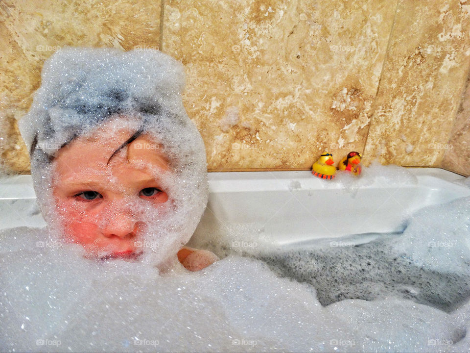 Young boy in bubble bath