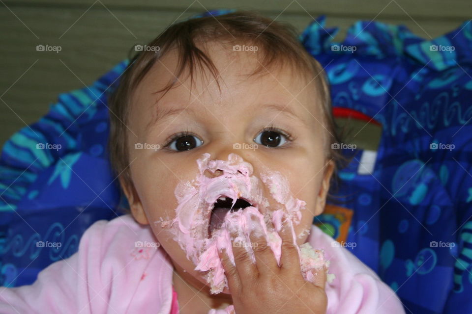Cake on her face.
