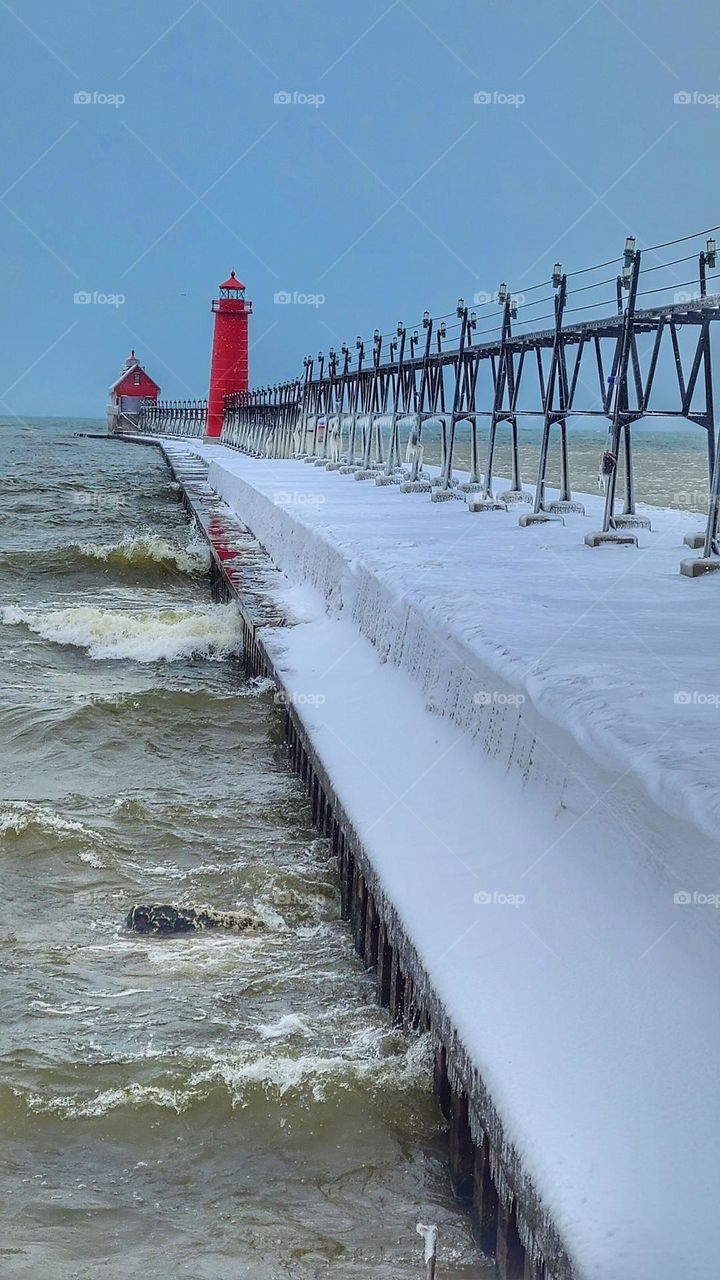 vertical photo of winter lighthouse