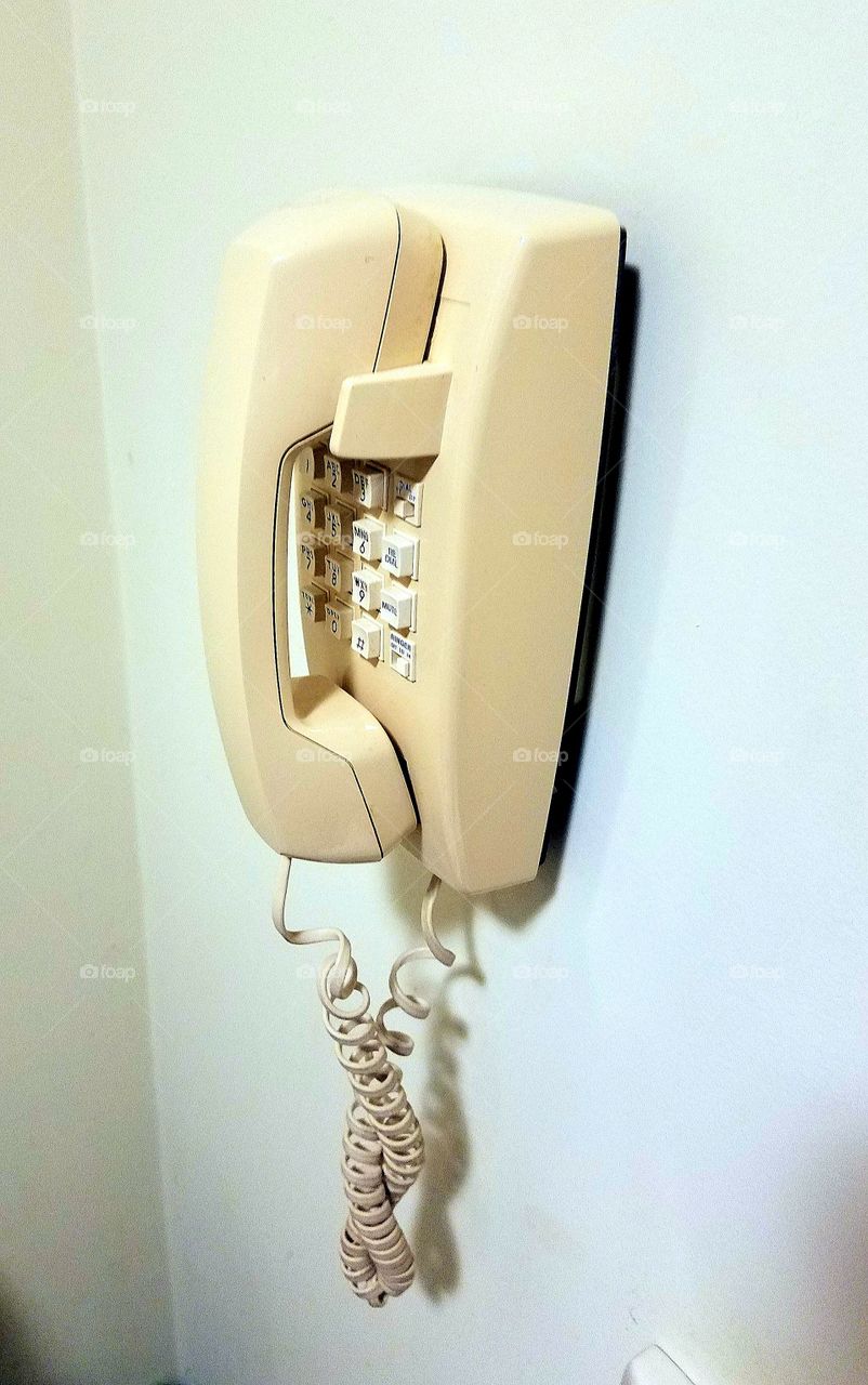 Wall hanging telephone push button dialing, retro style, handset. No ringtone choice.