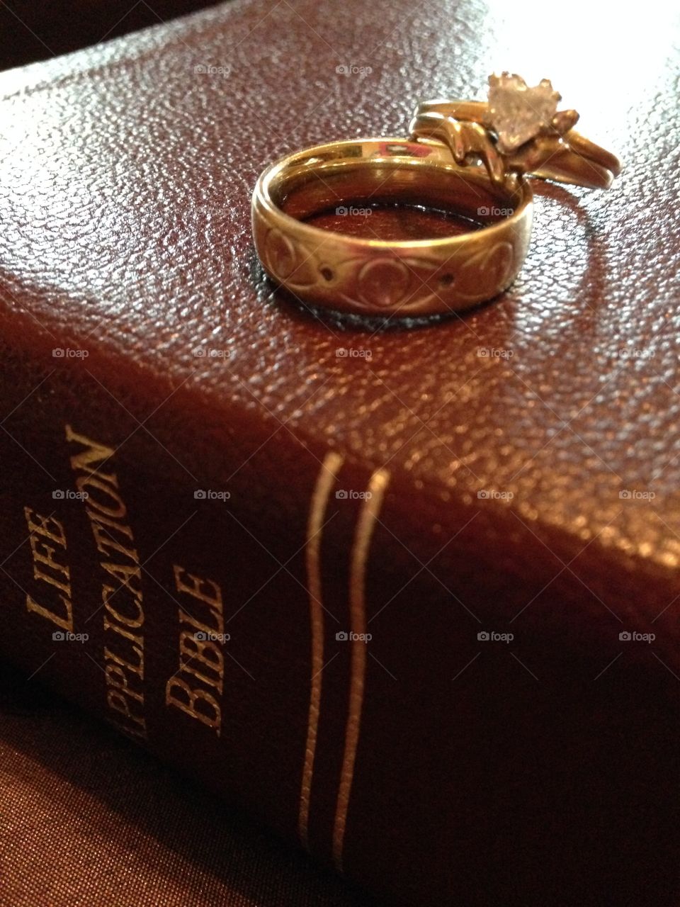 True love. Wedding rings on top of a Bible