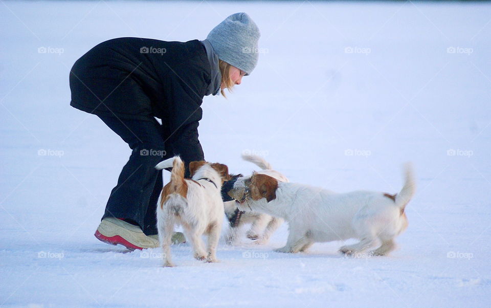 Girl playing with dogs