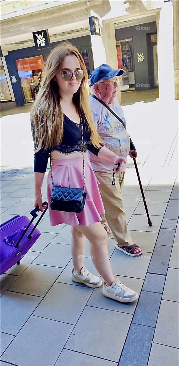 These people are taking a lovely stroll along the pedestrian zone in “Munich”, capitol of “Bavaria” on a sunny afternoon in August 2024. Hypnotic Productions