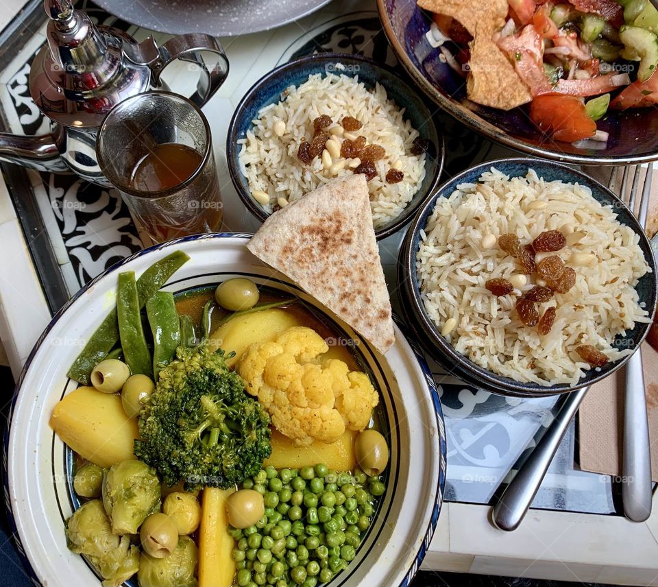 Vegetable tajine, white rice with raisin, fattoush salad and Maroccan tea 