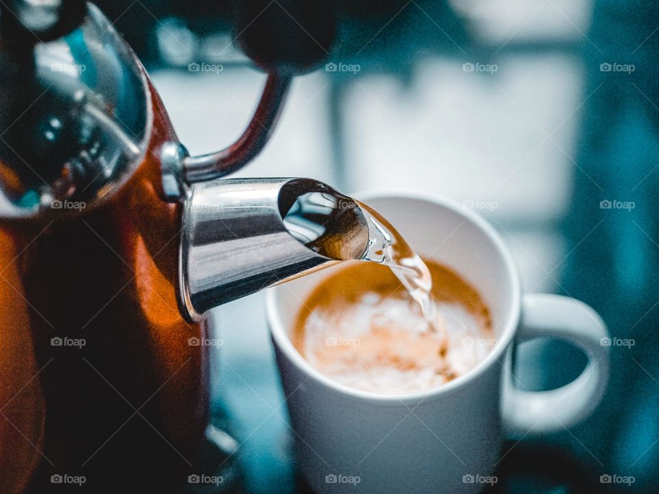 Pouring hot water to make coffee