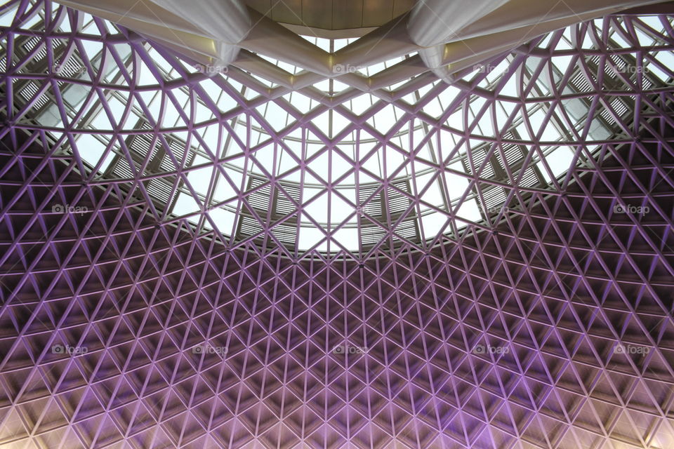 The purple, intricate ceiling of Kings Cross Railway Station in London.