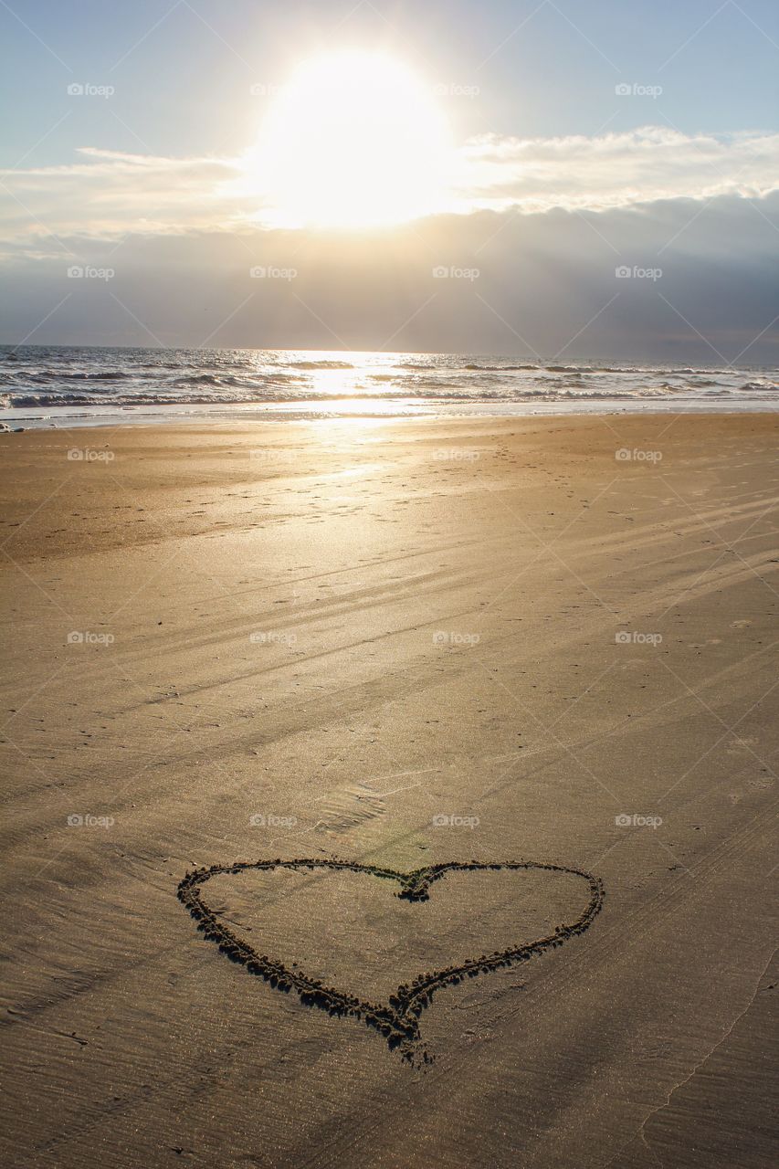 Heart shape on sand at beach