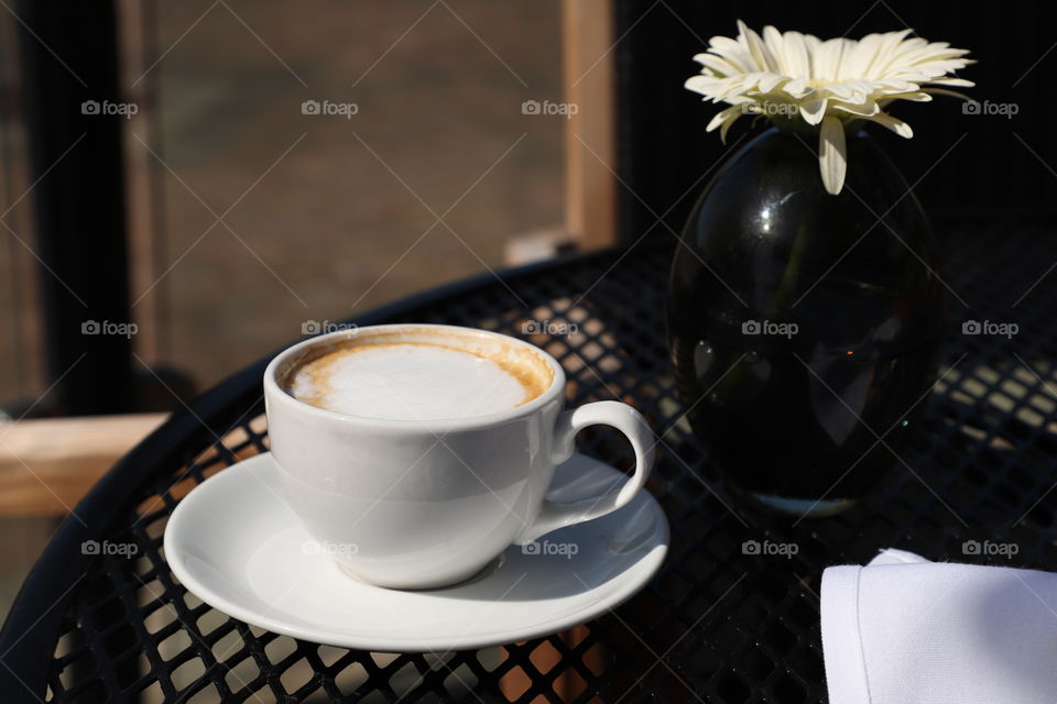 Latte on a patio table 