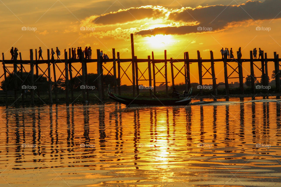 Silhouette of a people on pier during sunset