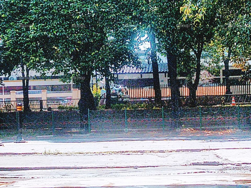 In the distance you can see a merchant pulling a merchandise cart