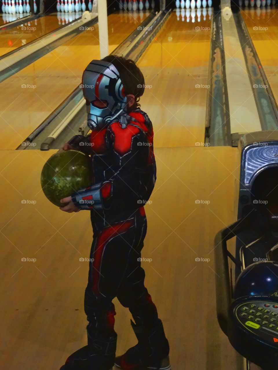 Young Boy Bowling
