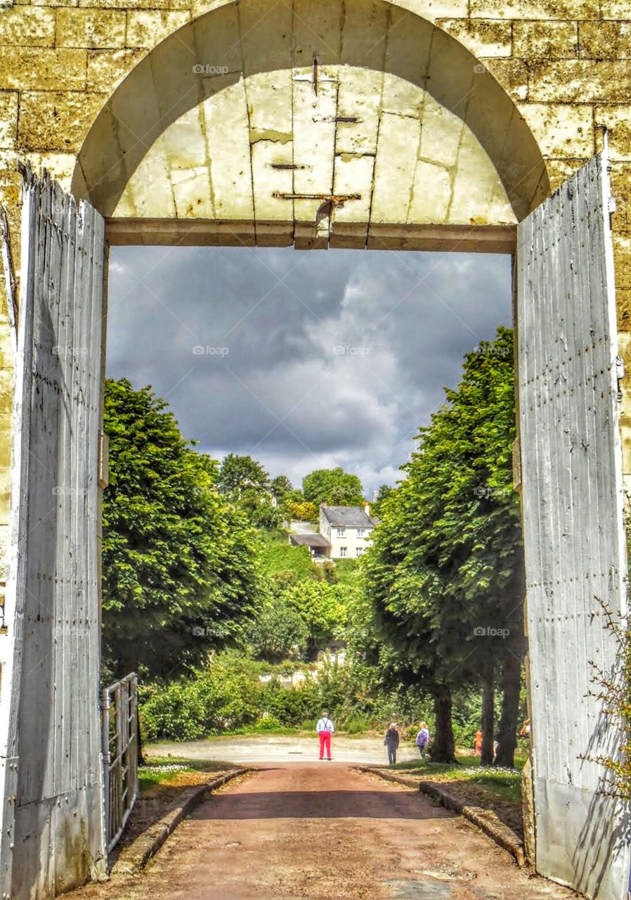 Storm brewing over small, ancient French village