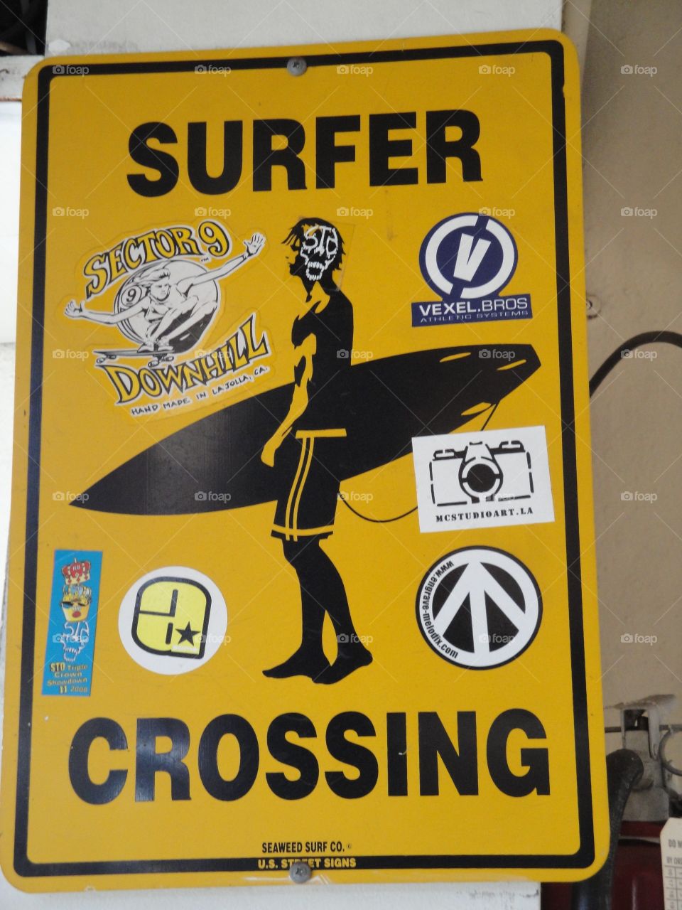 Surfers crossing sign