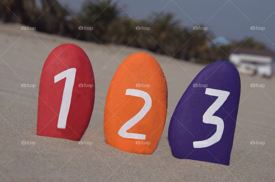 One, two, three or 123 numbers on colourful stones