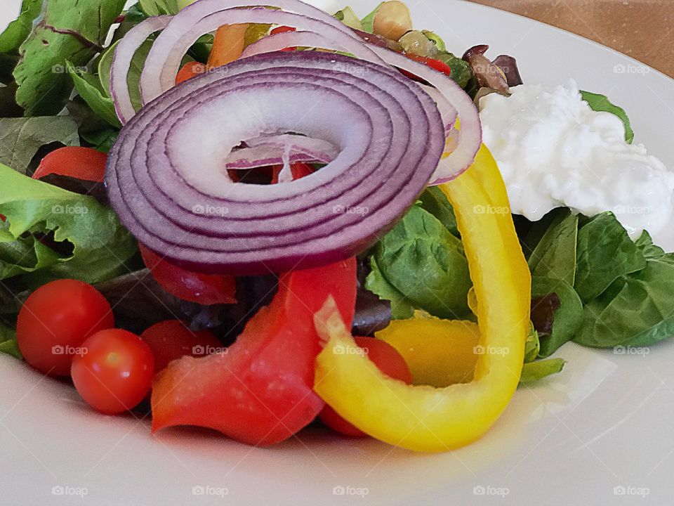 Vegetable salad with yogurt in plate