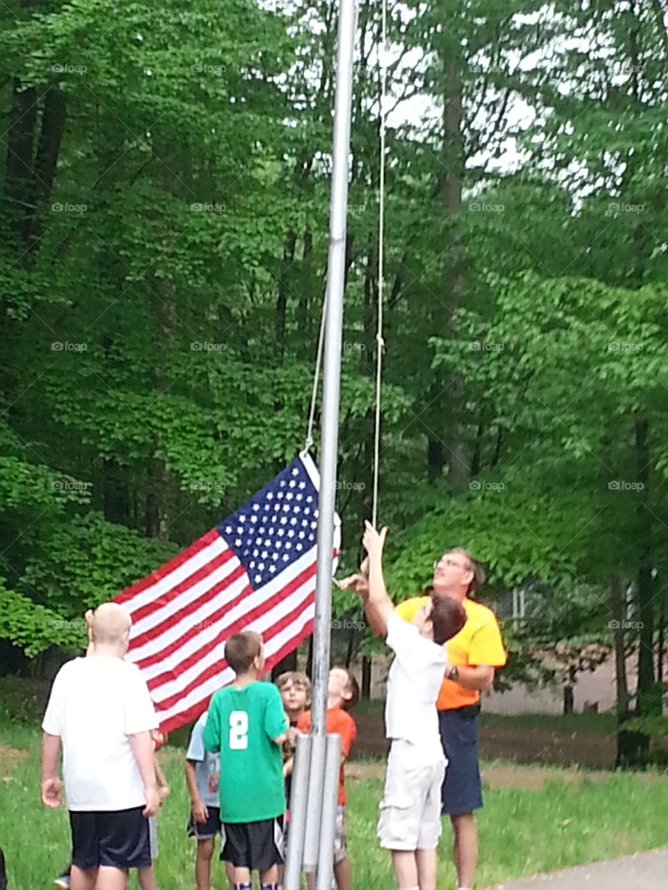 Raising of the Flag. Boyscouts raising of the Flag