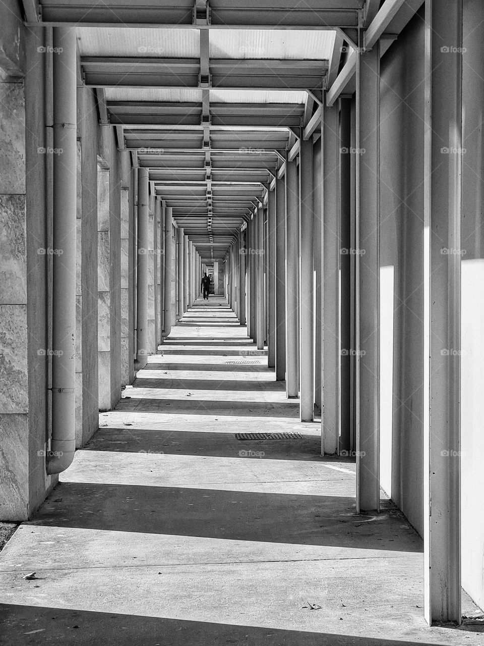 perspective of long porch photographed in black and white