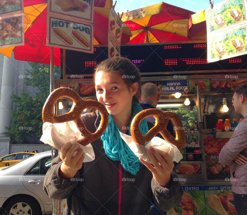 Girl holding hot dog in hand