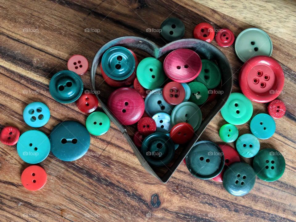 red and green buttons in a heart cookie cutter
