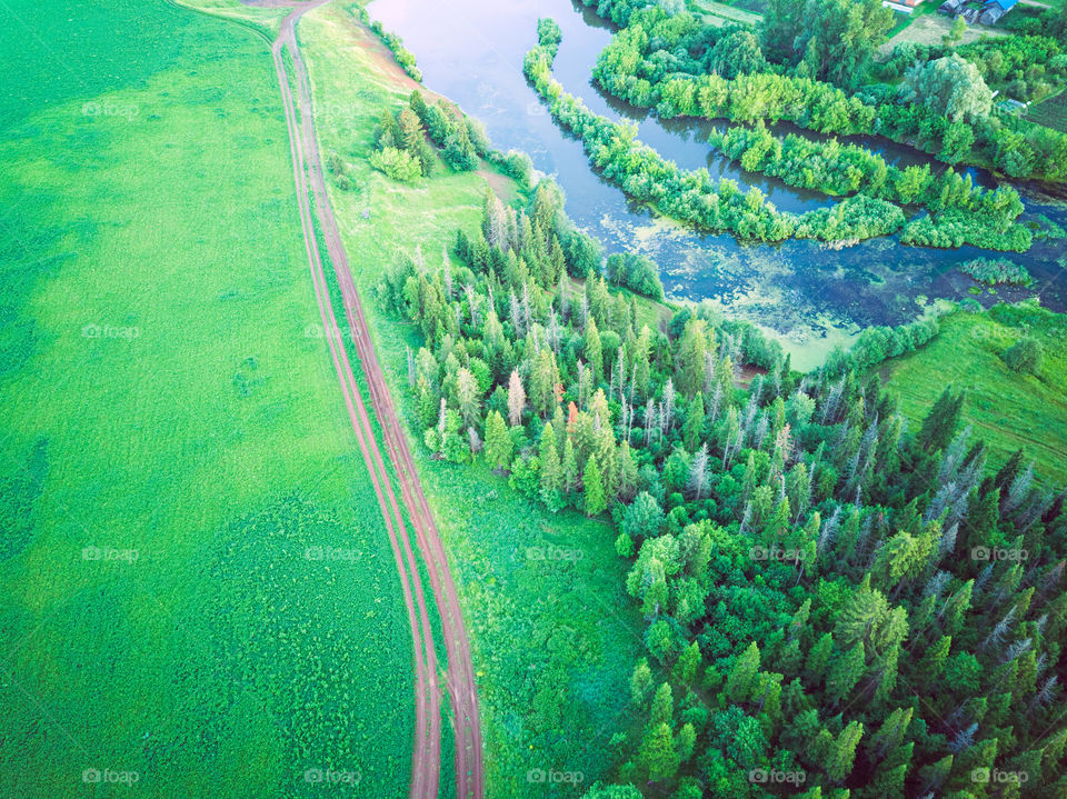 Aerial view of countryside landscape with river and forest