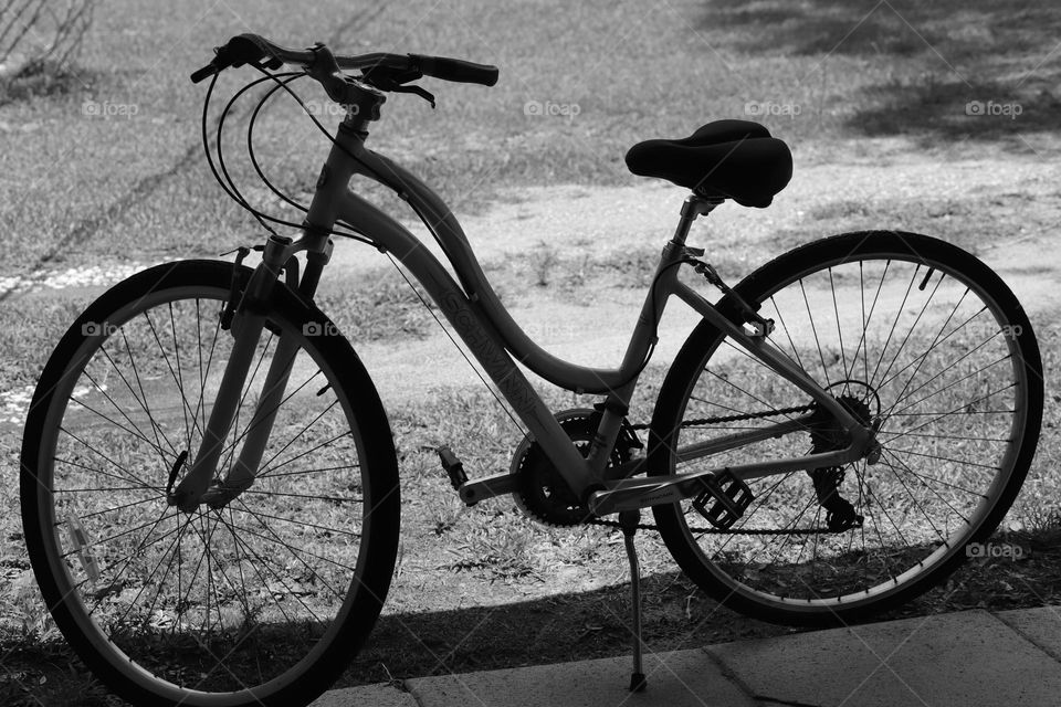 beauty, melancholy and nostalgia of a lone bicycle silhouette black and white