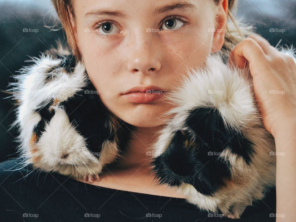 Girl with her guinea pig