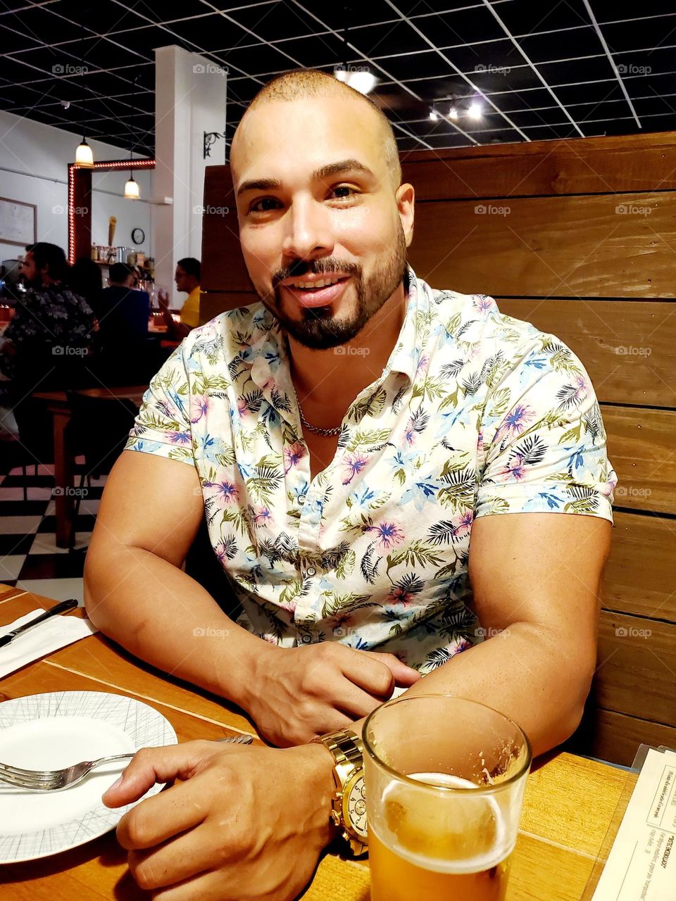 enjoying a beer while waiting for food to be served