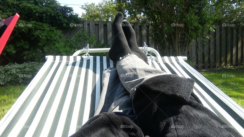 Feet up, just chilling in the sun on the hammock
