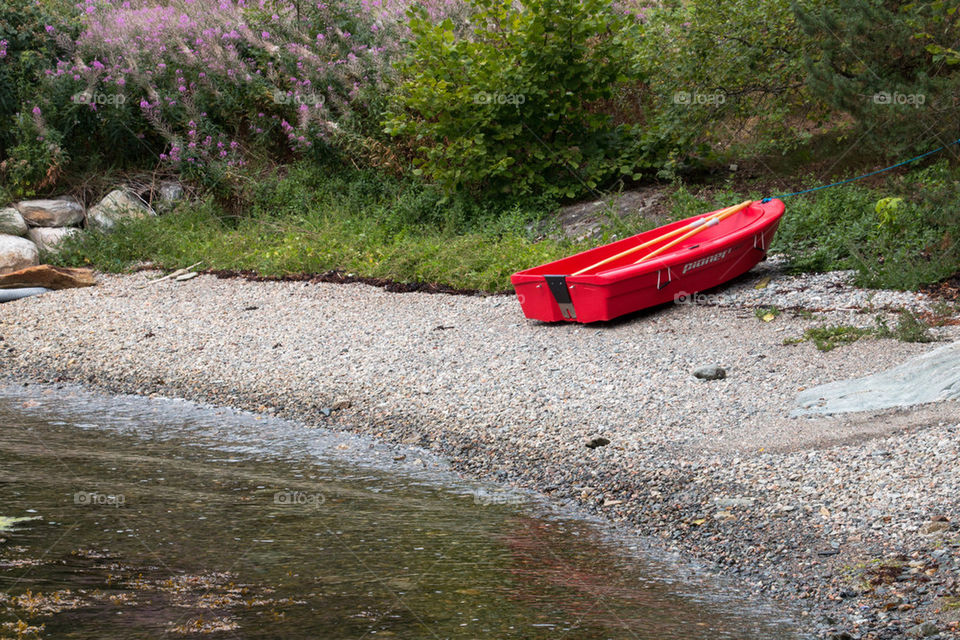 Red boat on beach